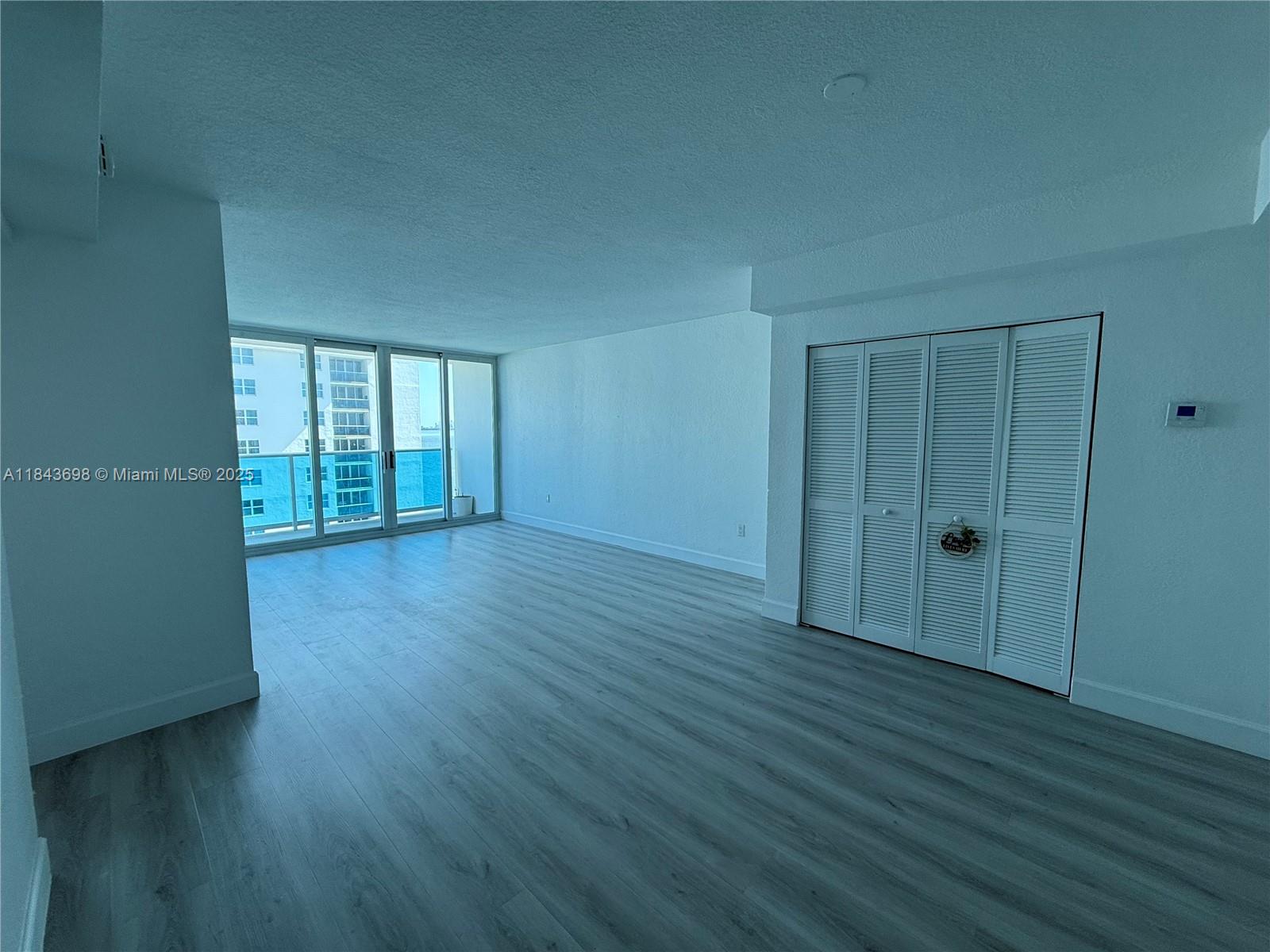 This bright and spacious one-bedroom condo in North Bay Village offers a fresh blend of comfort and style in a highly sought-after waterfront community. The interior features warm wood flooring throughout, a modern kitchen, and plenty of closet space throughout the condo, all designed for easy everyday living. The sunlit bedroom includes a generous walk in closet. Sliding glass doors open to a beautiful water views, creating a serene indoor-outdoor connection. Residents enjoy access to an updated pool and gym. Quiet and walkable waterfront area conveniently located close to the Beaches, Design District, Wynwood, Downtown, North Miami, lots of restaurants and shopping. Ready to move in!
