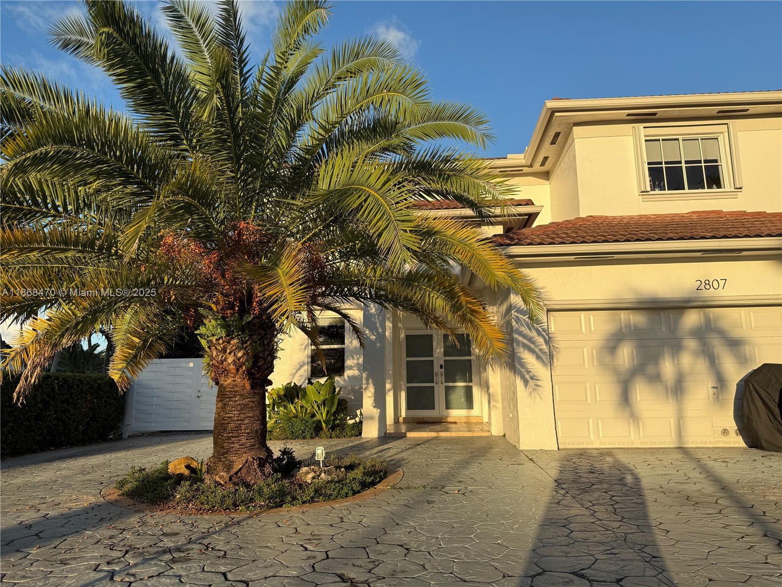 Discover comfort and style in this 3-bedroom, 2.5-bath corner home designed for modern South Florida living. The open layout with soaring ceilings and marble tile floors creates an airy, elegant atmosphere. Each bedroom has custom closets for smart storage. The kitchen offers stainless steel appliances, microwave, dishwasher, and a cozy breakfast nook. Step outside to a backyard perfect for entertaining, with a built-in BBQ and prep island. Highlights include space for an RV, boat, or work vehicle, plus the option to keep select furnishings (dining table, patio set). Garage space not available as part of the rental. Conveniently located near top-rated schools, major highways, and Dolphin Mall, this home blends practicality with lifestyle.