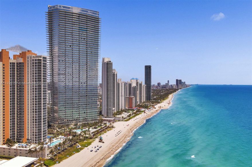 Enjoy elevated ocean-front living at the Residences by Armani Casa by world-class architect Cesar Pelli and interior design by the acclaimed fashion designer Giorgio Armani. This floor-through residence offers the best sunrises and sunsets from its spacious balconies that come equipped with an outdoor grill and refrigerator. This ready to move residence is tastefully decorated and has 3 beds + den with 3 1/2 baths, 10 ft. high ceilings, floor-to-ceiling glass windows; 10 ft. deep balconies, and an Armani designed Dada kitchen featuring Wolf Sub-Zero appliances, and spa-like marble-clad Armani Roca bathrooms. Residences by Armani Casa offers a full service restaurant, spa, gym, pilates, hair salon, theater, kids area, bar, beach services and much more.