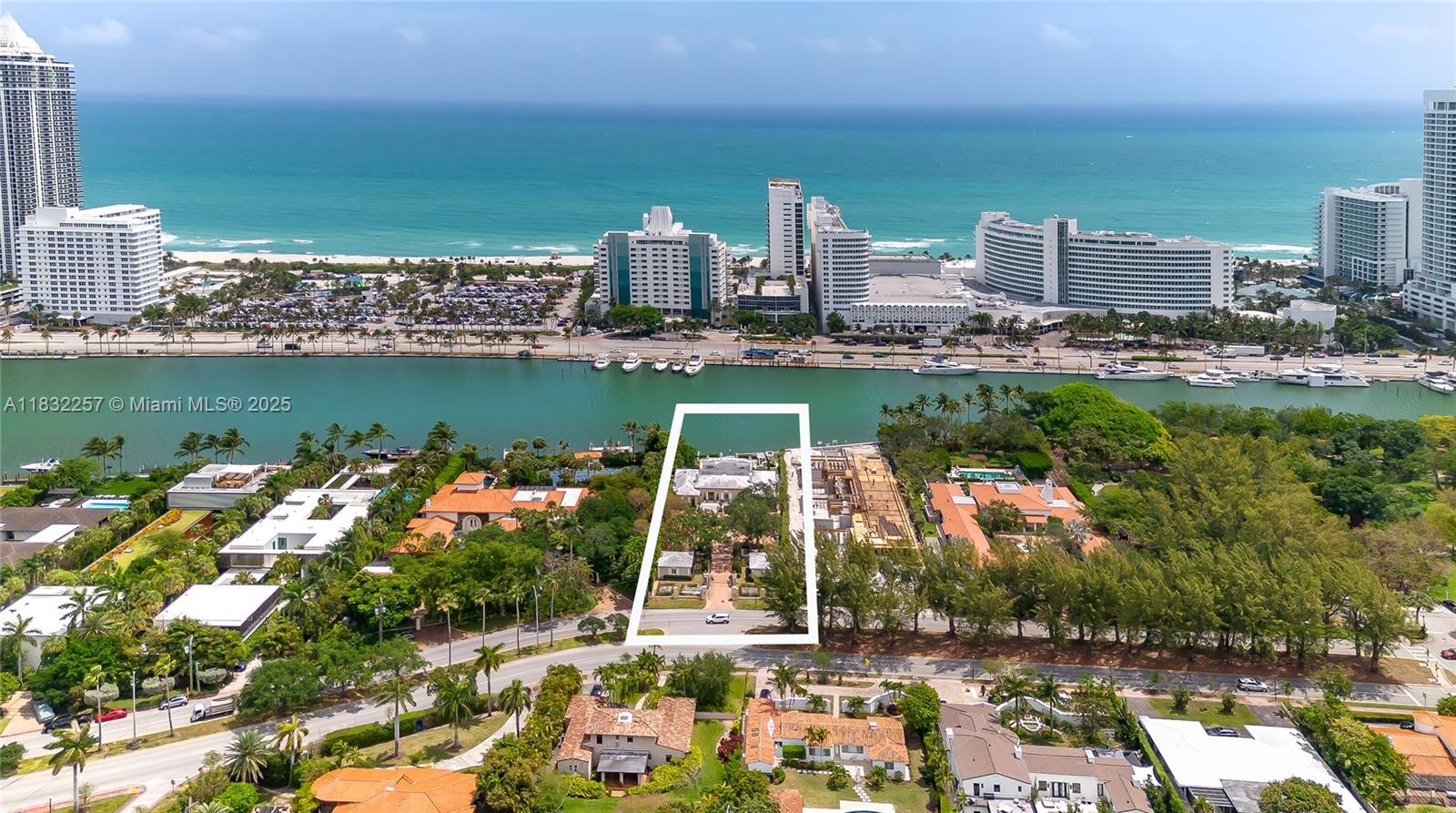 Set on a rare 31,900 square-foot lot, this Miami Beach estate offers 100 feet of water frontage with ocean access, located on prestigious Pine Tree Drive. The main residence features formal living and dining rooms, a Florida room, and a bright chef’s kitchen. A detached guest house adds flexibility for hosting visitors or accommodating extended stays. Outdoors, a heated saltwater pool is surrounded by mature landscaping and ample space to relax or entertain. Opportunities to own a property of this size and location in Miami Beach are few and far between making this a smart and timeless investment.