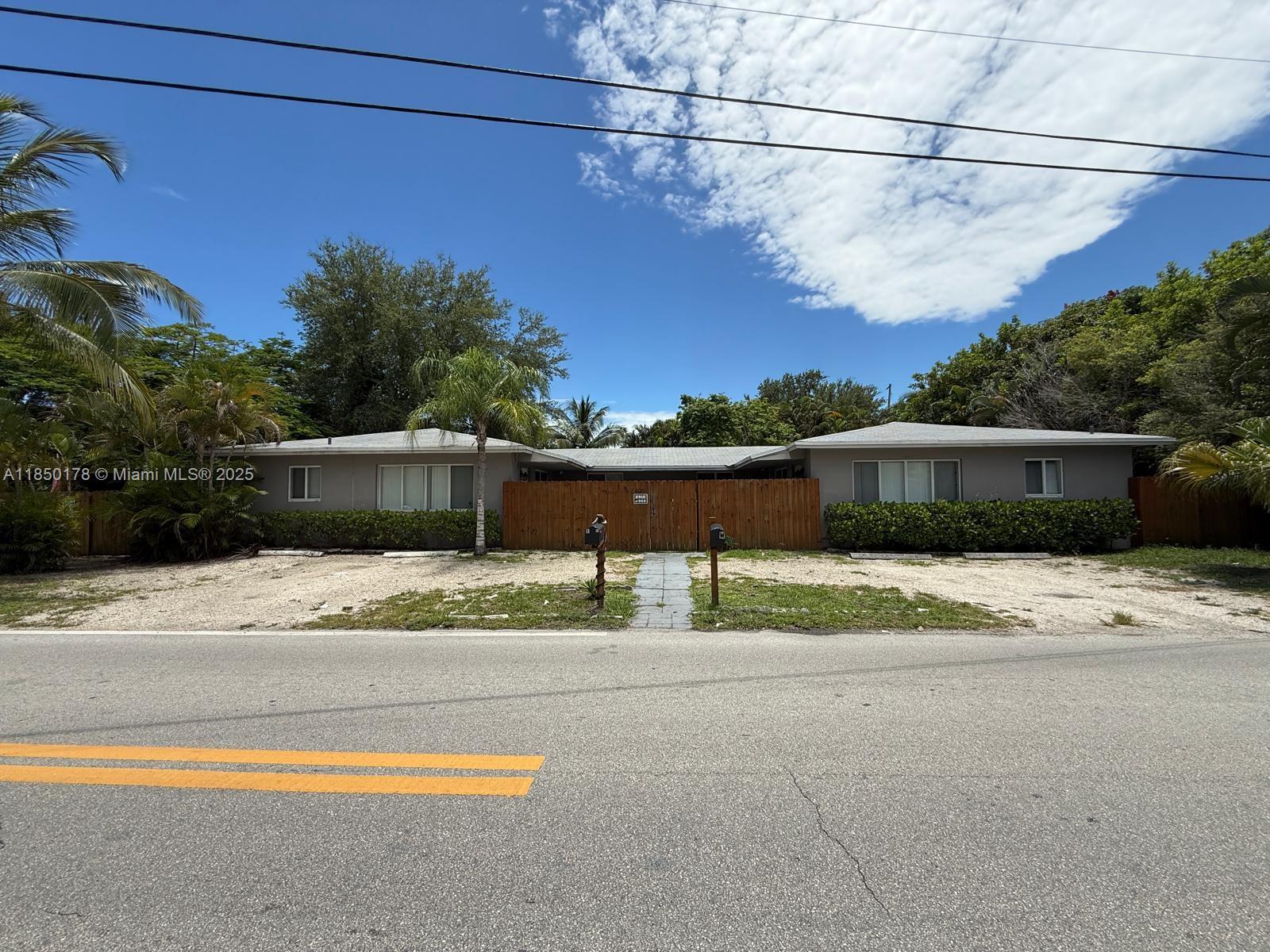 Stunning renovated 2-bed, 2-bath home in the heart of Progresso, Fort Lauderdale. Enjoy a brand-new kitchen with 42" wood cabinets, stainless steel appliances, and a double sink. Both bathrooms feature modern finishes and frameless glass showers. Upgrades include new hurricane impact windows, flooring, doors, light fixtures, and in-unit washer/dryer. Spacious bedrooms and a large, fully fenced backyard ideal for entertaining or relaxing. Freshly painted inside and out with great natural light and layout. Located in a highly desirable neighborhood near downtown, shopping, and beaches. This move-in ready home blends style, comfort, and convenience. A must-see!