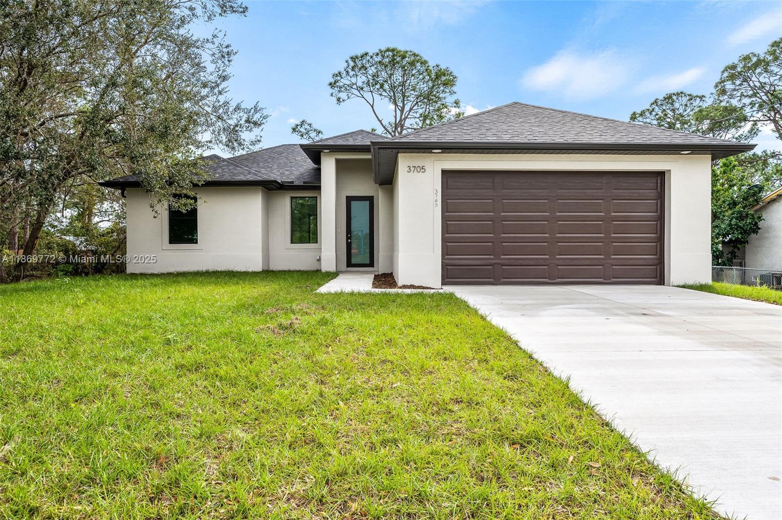 This newly built 3-bedroom, 2-bathroom home is the perfect blend of modern design and comfort. With a spacious and open layout, this home offers everything you need for relaxed living and effortless entertaining. The bright and inviting family room is the heart of the home, featuring tile floors throughout for easy maintenance and a fresh, contemporary feel. The impact windows provide peace of mind during storm season while allowing natural light to flood the space. The master suite is a private retreat, complete with a large walk-in closet and an ensuite bathroom. The two additional bedrooms are generously sized, perfect for family or guests, with a shared bathroom conveniently located between them. Ask for a video