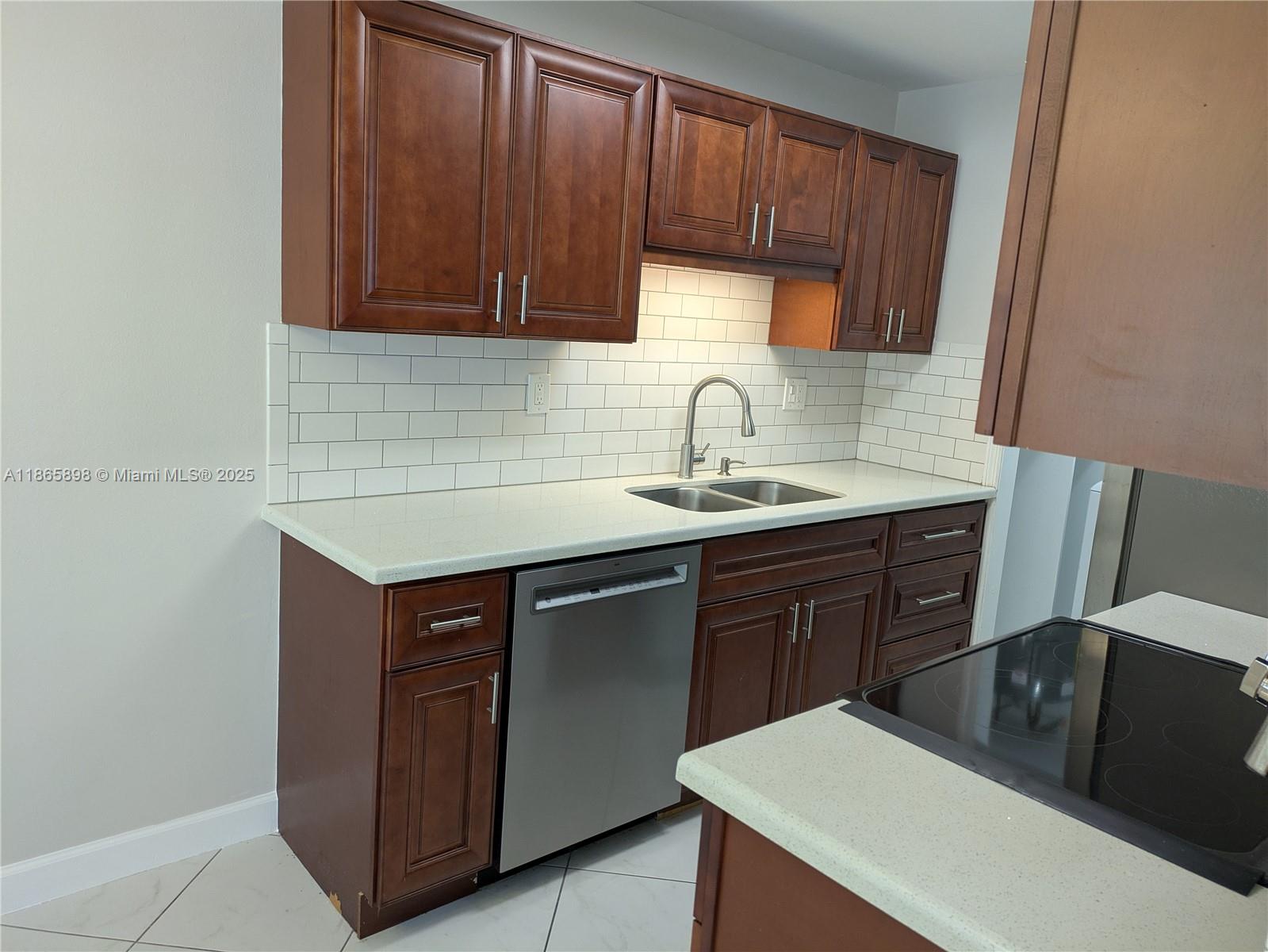 Bright- Clean - very updated, -updated kitchen with stainless appliances, new washer and dryer in the unit, big fenced yard with patio- pet friendly, large bedrooms- great storage with extra storage room, blinds through out- new A/C, bathroom with double sink, ready to move in-