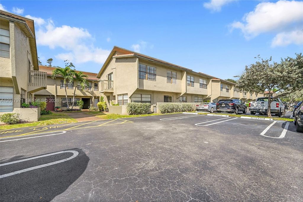 Photo of 2532 Coral Springs Dr #2532, Coral Springs, FL 33065 (MLS # A12017971)