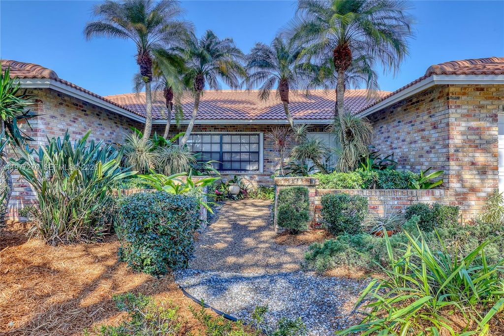 Photo of 1048 NW 110th Ln, Coral Springs, FL 33071 (MLS # A11977270)