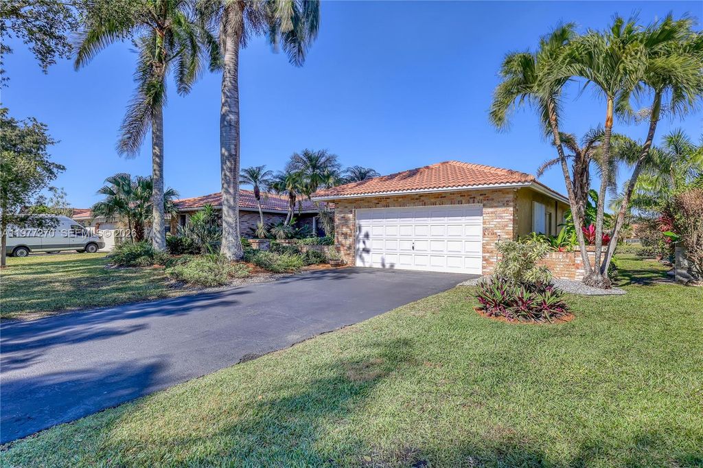 Photo of 1048 NW 110th Ln, Coral Springs, FL 33071 (MLS # A11977270)