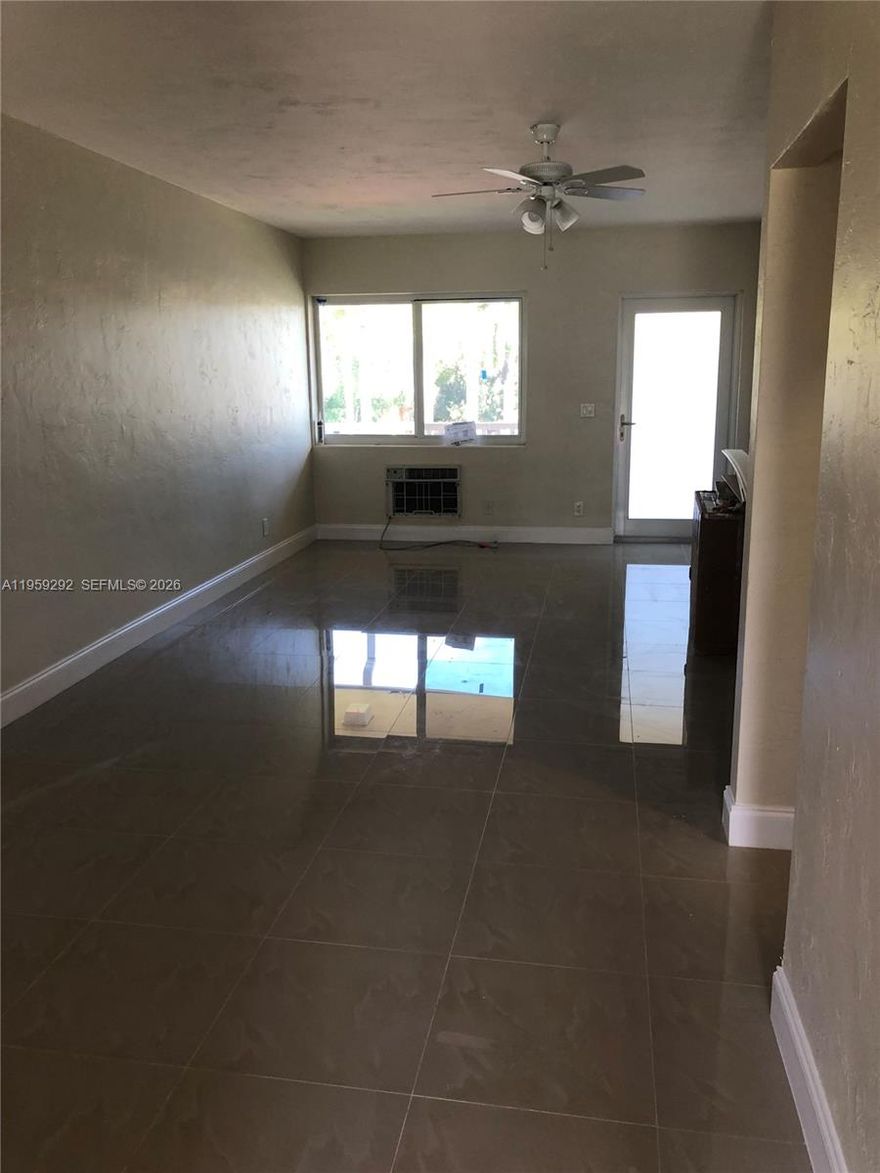 Show & Rent! 2 bedroom 1 bath unit in a gated community, minutes from Gulfstream Park, shops and restaurants. Remodeled kitchen, tiled throughout, lots of light, impact windows & doors and one assigned parking spot. Building offers social room, laundry facilities and heated pool. A must see!