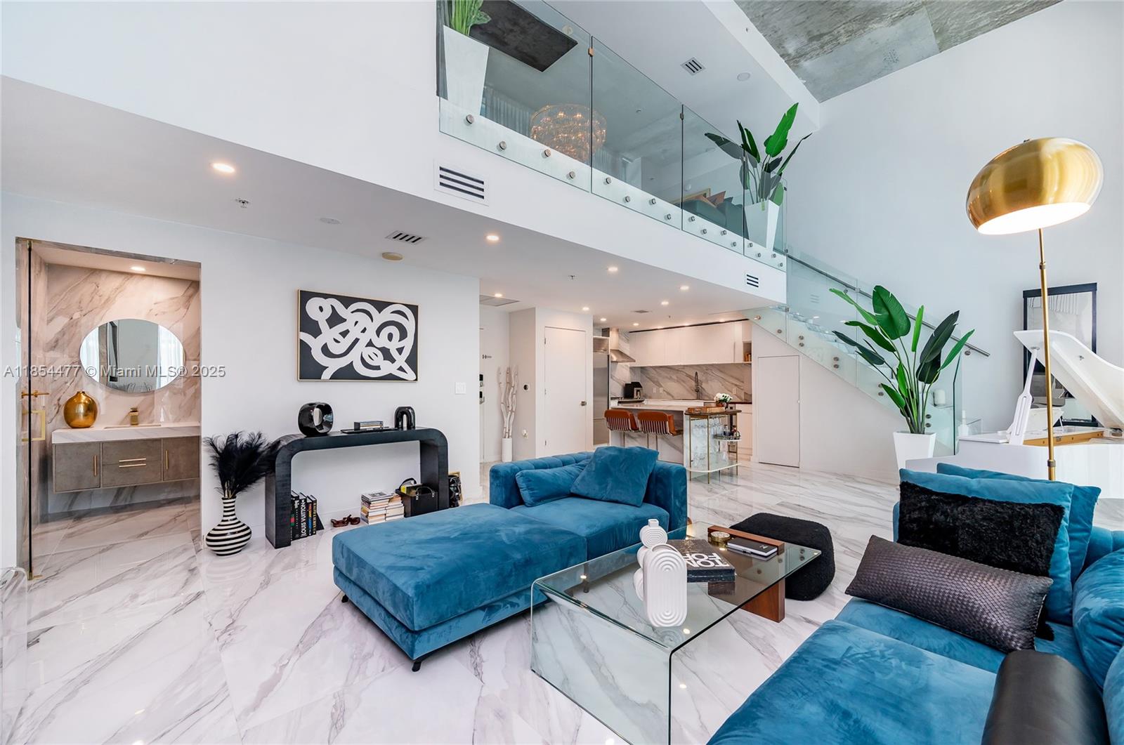 Experience elevated living in this one-of-a-kind, fully furnished 3-story luxury loft in the heart of Midtown Miami. This expansive residence boasts soaring ceilings, sleek modern finishes, and floor-to-ceiling windows that flood the space with natural light. Enjoy rare private access to the pool deck directly from your unit, plus an oversized private terrace perfect for entertaining or unwinding under the stars. The open-concept layout offers seamless indoor-outdoor living, with designer furnishings throughout, a gourmet kitchen, and spa-inspired bathrooms. Located in a premier full-service building with top-tier amenities, and just steps from world-class dining, shopping, and the vibrant art scene of Wynwood and the Design District.