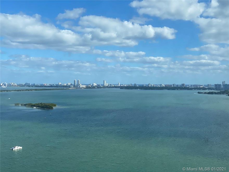 Welcome home! This stunning skyhome features floor-to-ceiling glass walls with direct bay & ocean views- your new home is drenched in natural light & has gleaming hardwood floors, onyx backsplash & a huge master suite with walk-in closet & upgraded bathr oom. Sliding glass partitions open up to 2nd bedroom expanding living area and views. A huge terrace extends the entire length of the condo - AMAZING! Located in Performing Arts District- onsite dining, sundry store, salon & recreational park in front.