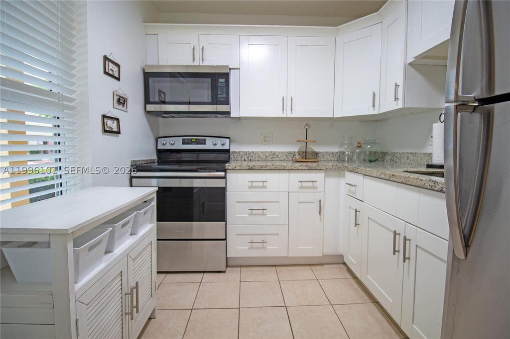 Photo of 6020 NW 64th Ave #108, Tamarac, FL 33319 (MLS # A11996101)