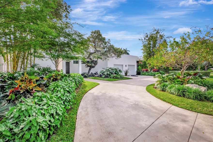 Welcome to this exquisitely designed home, located in coveted Miami Shores golf club community. This home offers  4 bedrooms, 4 bathrooms, on an expansive 12,900 sq. ft., steps away from Biscayne Bay. Recent renovations have seamlessly integrated the living room with the beautifully updated contemporary kitchen, overlooking the sunroom, outdoor patio, and pool. Boasting open living spaces, a refined saltwater pool and spa, meticulously landscaped gardens, and impact-resistant windows and doors. Additionally, the inclusion of a generator and natural gas amplifies the comfort and convenience of the home. A generously sized lot provides ample space for outdoor entertaining and tranquil relaxation.