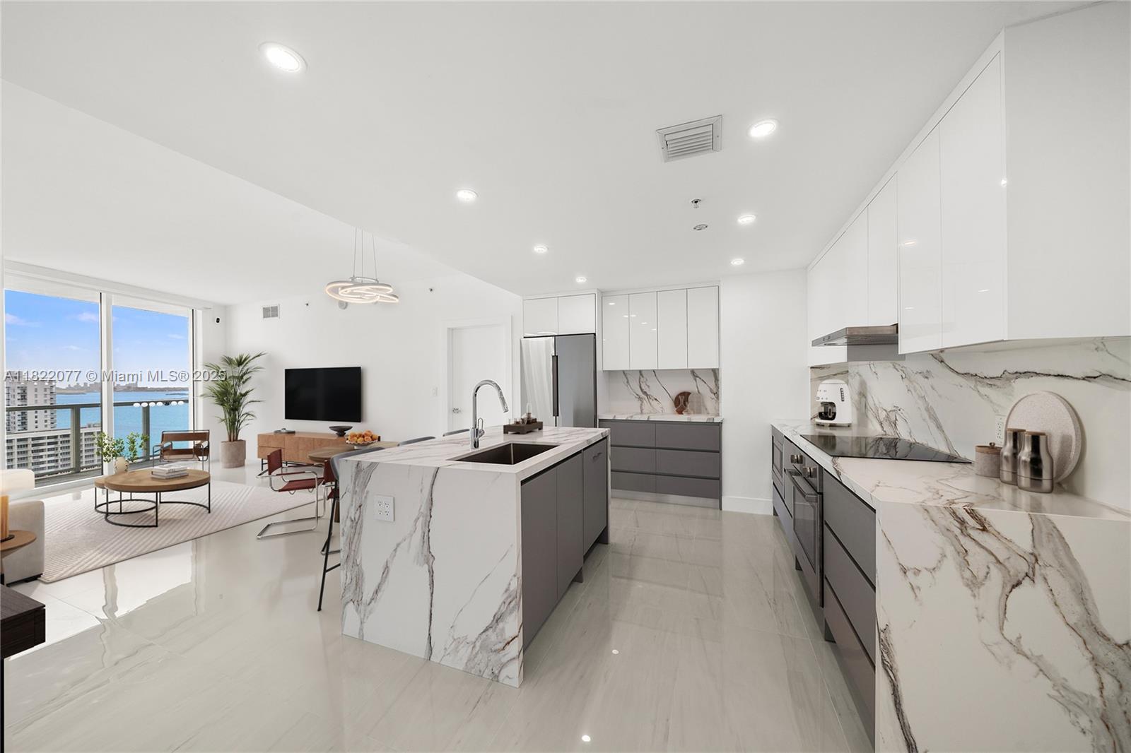 Live above it all in this fully renovated 2BD/2BA at Quantum on the Bay with direct, unobstructed bay views from every room. This beautifully remodeled residence features Italian brand finishes, a sleek European-style kitchen with stainless steel appliances, large-format porcelain floors, and spa-like bathrooms. Enjoy 9' ceilings, floor-to-ceiling impact windows, spacious walk-in closets, and a large balcony overlooking Biscayne Bay and Margaret Pace Park. Resort-style amenities include two pools, a state-of-the-art fitness center, sauna, club room, theater, market, business center, and more. Ideally located steps from the park and minutes to Wynwood, Downtown, Design District, Brickell & the beach. A move-in ready gem with endless views—schedule your tour today!