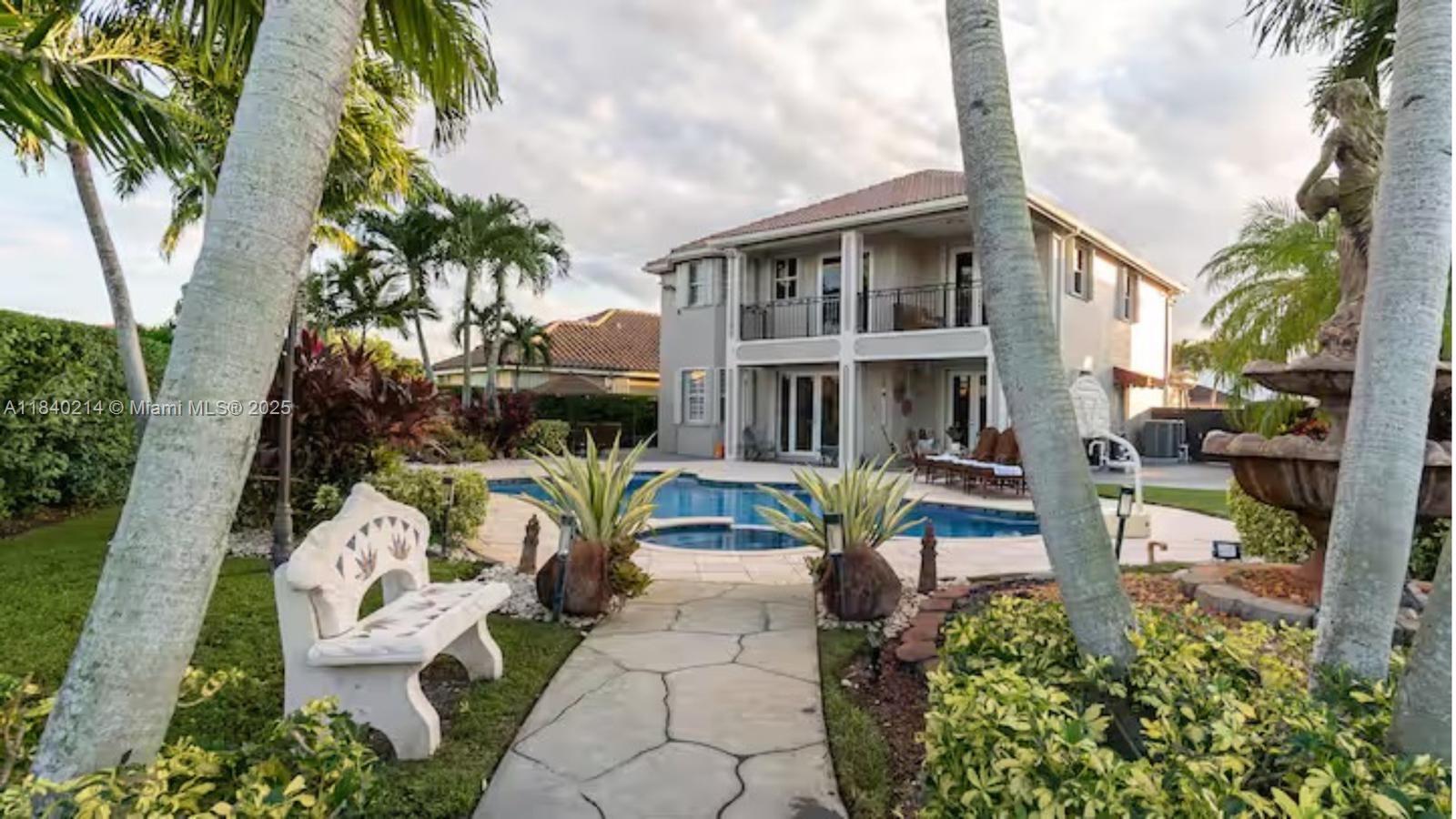 Welcome to this stunning two-story Mediterranean-style villa offering refined luxury and exceptional outdoor living. This elegant home features expansive balconies with wrought-iron railings, a tile roof, and beautiful architectural details throughout. Fully furnished 5 bedrooms and 4 bathrooms to entertain your friends and family
Step into your private resort-like backyard, complete with a sparkling pool, integrated spa, and an oversized stone-tiled deck—perfect for entertaining or simply relaxing under the sun. Enjoy multiple lounge areas, covered patios, and seamless indoor-outdoor flow through large glass doors.