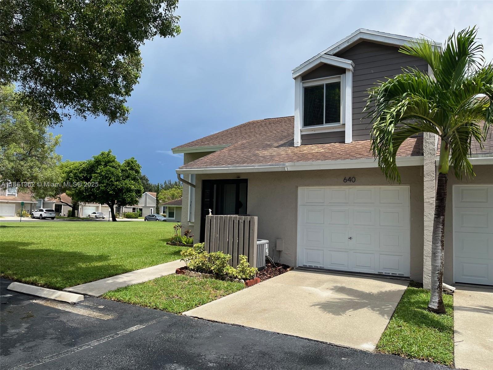 Beautifull 3-bedroom, 2 1/2-bath corner villa in the highly desirable Woodgate community of Sunrise.This is the largest unit currently available and features a spacious, open-concept layout with soaring vaulted ceilings and an abundance of natural light throughout. Step out to the screened-in patio, which opens to a lush common green space—an ideal setting for relaxing or hosting guests in total tranquility.Woodgate offers resort-style amenities including a sparkling pool, tennis courts, and a children’s play area. Conveniently located near I-595 and I-75, and just minutes from Sawgrass Mills Mall, A+rated schools, top dining, shopping