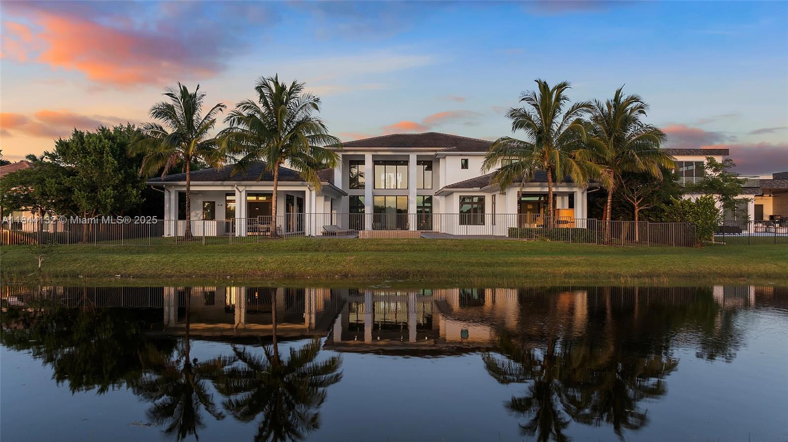 Discover a Zen-inspired sanctuary in prestigious Windmill Reserve. Completed in 2018, this 9,019 sf estate rests on a 28,172 sf lot backing to protected greenspace, leaving no rear neighbors. Seven ensuite bedrooms and 8.5 baths define refined living. The chef’s kitchen showcases Thermador appliances, a vast quartz island, pot filler, gas cooktop, wall oven, butler’s pantry, and wet bar. The primary retreat provides dual walk-ins, a sitting area, and a spa bath with a soaking tub inside a glass shower, plus a dual sink. Entertain in the wine cellar, media room, loft, or smart home gym. A 4-car garage and security system add peace of mind. Outdoors: 60×16 salt water infinity pool, heated spa, covered lanai, custom swings, and a pad for a future summer kitchen. See attached feature sheet.