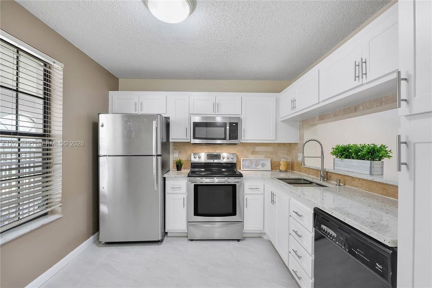 Beautifully remodeled 2-bedroom, 2-bath split bedroom corner unit condo in the heart of Coral Springs! This move-in ready home features a freshly painted interior, remodeled kitchen with new cabinets, granite countertops, and tile and carpet flooring, upgraded bathrooms with new vanities, sinks, and faucets. Private screened-in patio with storage, brand-new hurricane front door, 2025 AC, and newer hot water heater. Enjoy assigned parking directly in front of the unit plus plenty of guest parking nearby. Association covers building insurance, water, sewer, maintenance, and community pool access. Conveniently located near top-rated schools, shopping, dining, and malls.