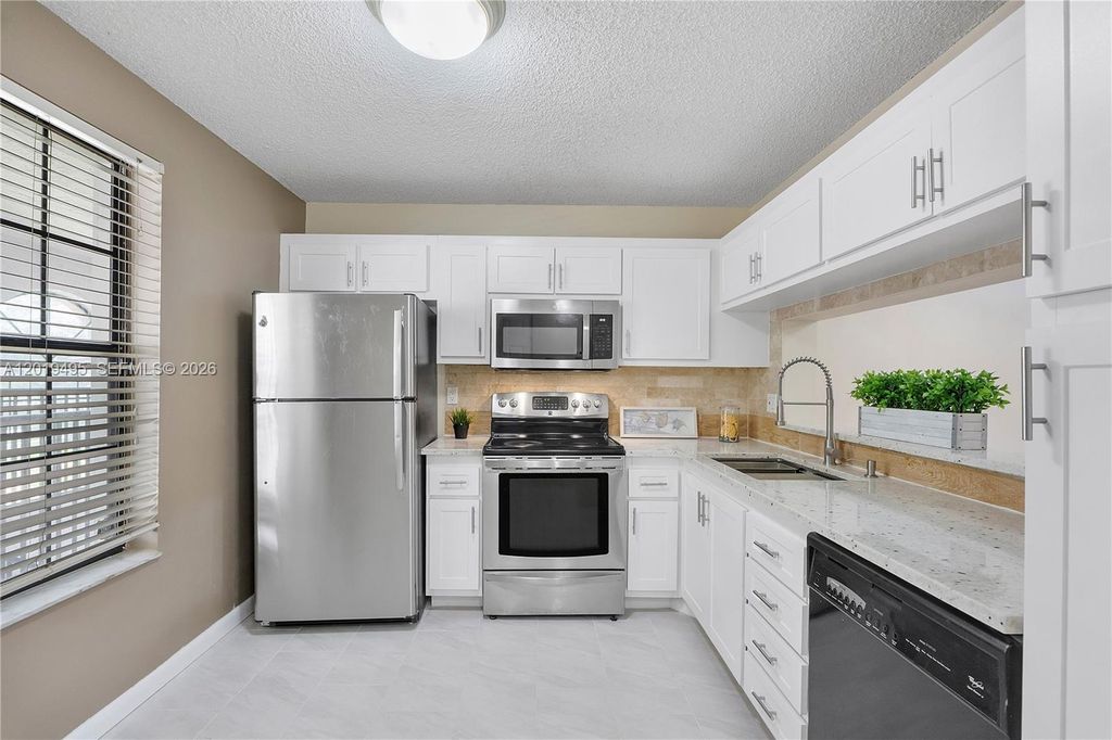 Photo of 2382 NW 89th Dr #2382, Coral Springs, FL 33065 (MLS # A12019495)