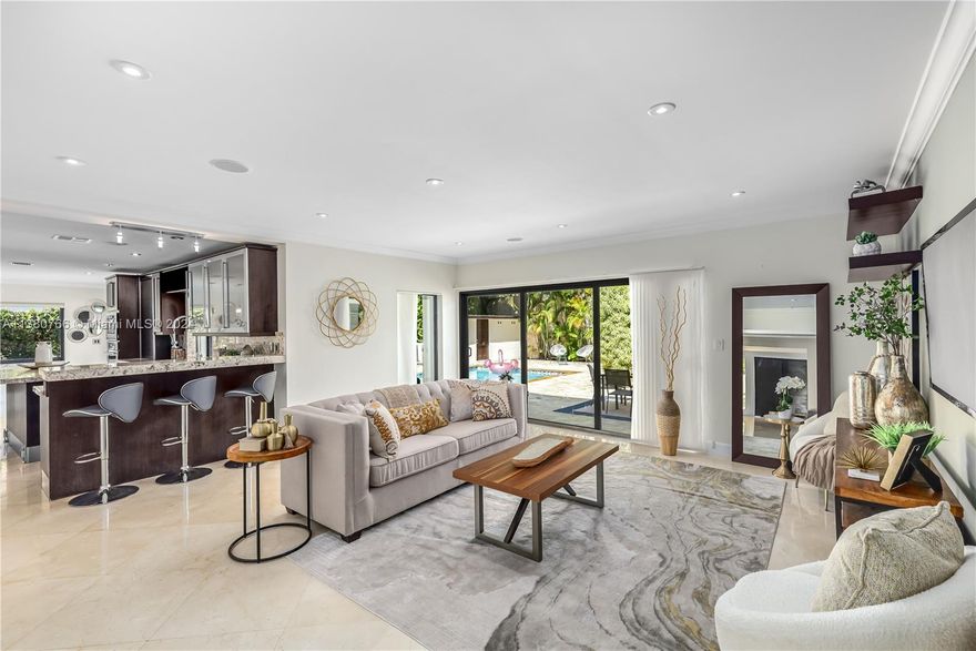 The ultimate Coconut Grove living experience in Bay Heights! This spacious multigenerational home offers 5 large BRs, 4 full Bath, & 2 half Bath. The bonus room makes a perfect home office, gym, or playroom & has a separate entrance. Entertain with ease in the 4,287 SF interior, featuring a Nolte kitchen, top-of-the-line appliances & generously sized living areas leading to the pool and BBQ area. Outside, your sparkling pool invites you to unwind & bask in the sun. Feel secure in this 24/7 police patrolled & walled property that offers privacy & peace of mind. Discover the best price per SF home in Bay Heights & seize this fantastic opportunity. Located just minutes to Brickell & the Grove and close to beaches of Key Biscayne. The new Underline is walking distance !