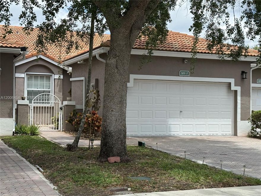 Beautiful Villa with 2 bedrooms, 2 bathrooms & 2 car garage overlooking a lake, remodeled throughout, open floor plan with vaulted ceilings, tiled floors, kitchen with wood cabinets and granite counter tops, stainless steel appliances, large master bedroom with walk-in closet, 2nd bedroom with built-in queen sized murphy bed that can be converted into a desk, impact doors and windows, accordion shutters, laundry room with full size washer and dryer, large screened patio with beautiful sunset views, two car garage with spacious driveway for additional parking. Gated Community with three entrances, includes a Clubhouse, two pools in the community, tennis courts and gym.