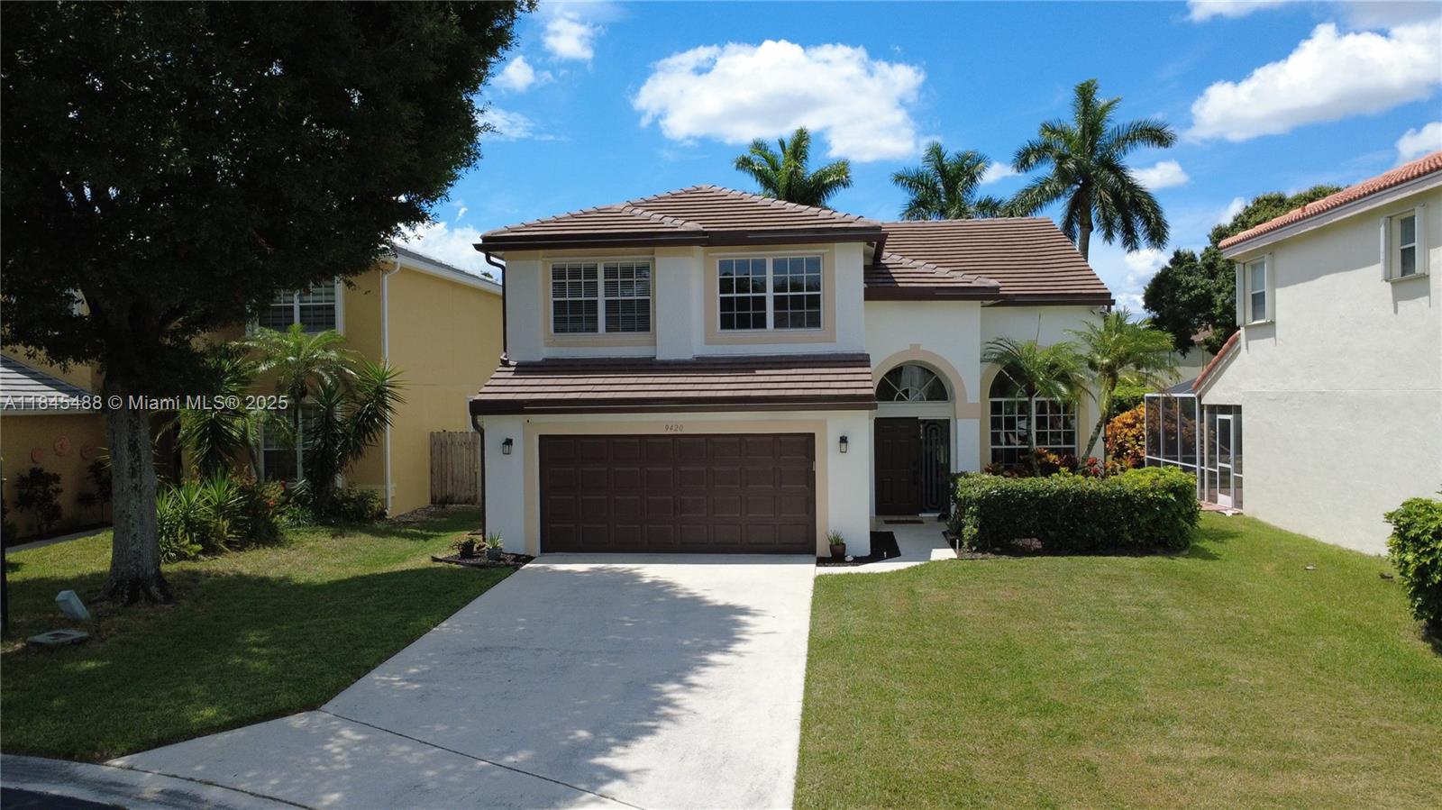 Welcome home to gated Symphony Bay in Boca Raton. This spacious 3+ bed, 2.5 bath 2-story Home sits on a Premier Cul-De-Sac Lot, featuring a ROOF installed December 2022! New Rain Gutters all around. The smart first floor plan features formal living and dining areas, island kitchen, breakfast nook and Family Room with 5.1 Surround Sound wiring, great for movie nights. Dual sliding doors on each side of the house open to a large 39 feet wide covered screened patio that creates an ideal indoor/outdoor living setup. All bedrooms are upstairs with beautiful Wood Floors, Travertine floors downstairs. The added 4th bedroom is ideal as an office. Long front Driveway is great for guest parking. This home is sited just a few steps away from the gorgeous & updated community amenities complex.