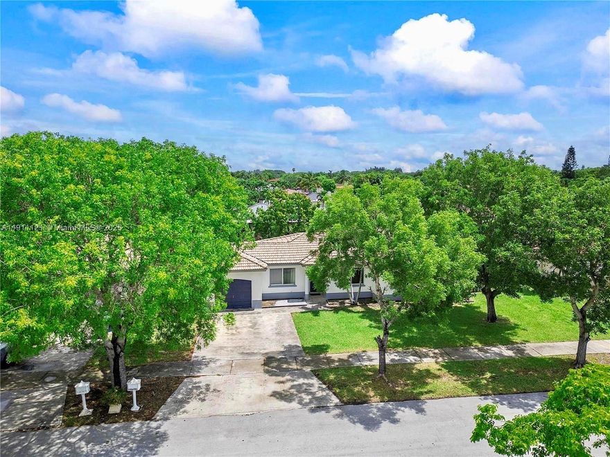 This beautiful Mediterranean-style home in Miami features 4 bedrooms, 2 full bathrooms, and a fully remodeled modern kitchen and bathroom. NO HOA. Located just 10 minutes from South Land Mall and 20 minutes from BlackPoint Marina, it offers both comfort and convenience. Inside, sleek tile floors provide easy maintenance. Enjoy seamless indoor-outdoor living with a spacious screened patio, a beautiful mango tree, and a Jacuzzi. The large yard offers endless possibilities. The converted garage serves as an independent living space, currently rented, providing extra income. It is conveniently located close to parks, schools, and shopping.