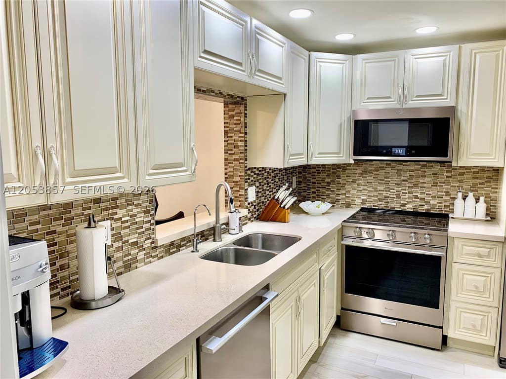 Photo of 619 NE 14th Ave #301, Hallandale Beach, FL 33009 (MLS # A12053857)
