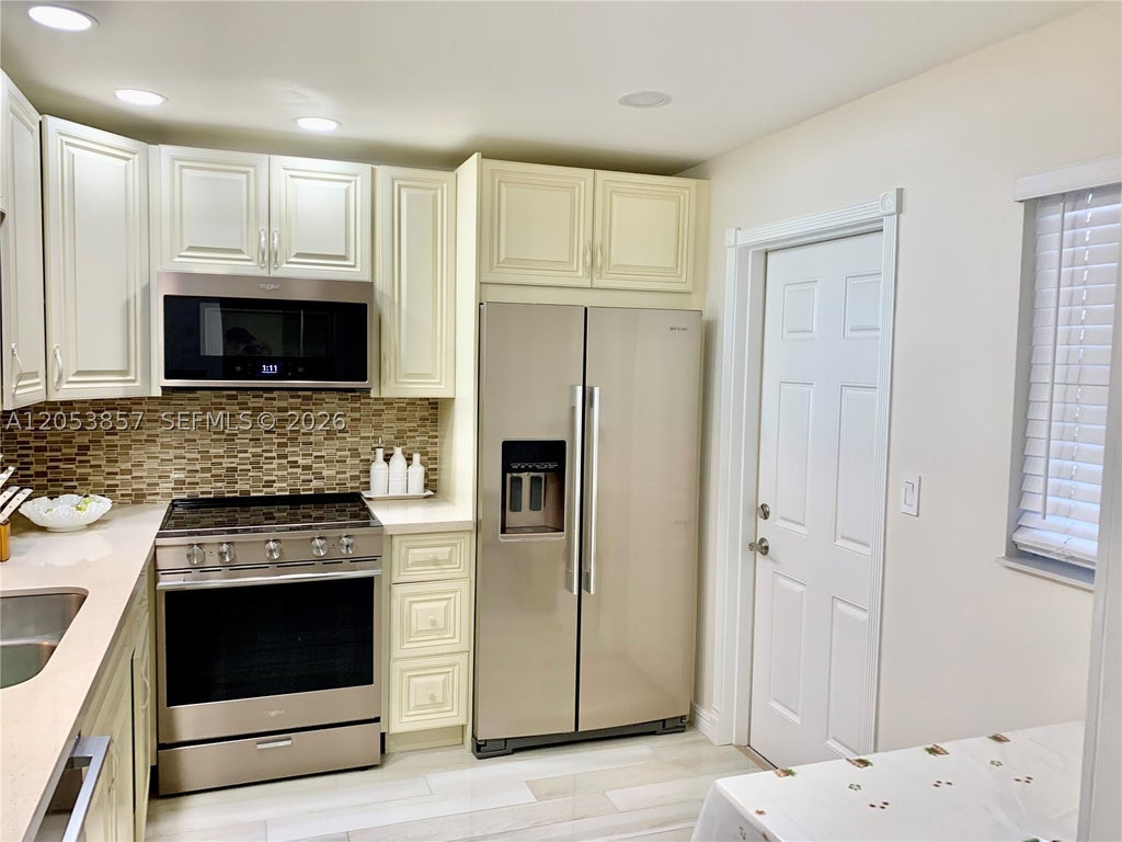 Photo of 619 NE 14th Ave #301, Hallandale Beach, FL 33009 (MLS # A12053857)