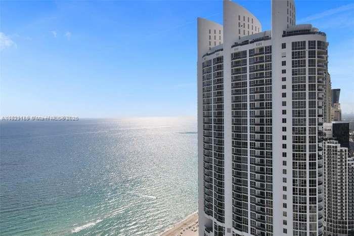 True luxury living in this beautifully condo on iconic Collins Avenue, Sunny Isles Beach. Enjoy private elevator access directly to your front door, breathtaking ocean and city views, and elegant, modern interiors. Offered fully furnished, it's a turnkey dream. Live the resort lifestyle with private beach access, pool, spa, gym, sauna, billiards, BBQ area, and more. Just steps from white-sand beaches, fine dining, and upscale shopping. Style, comfort, and location. Whether you’re entertaining guests or enjoying quiet moments, the spacious layout and premium finishes elevate your daily living. Don’t miss the chance to own a slice of paradise in one of South Florida’s most sought-after communities!!
