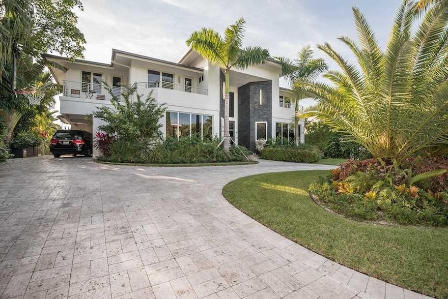 PRICE REDUCTION!! MAGNIFICENT, DOUBLE FRONTED MODERN COMTEMPORARY DESIGN HOME SITUATED ON A QUIET STREET IN GATED BAL HARBOUR VILLAGE! BUILT LESS THAN 2 YEARS AGO FOR OWNERS-QUALITY MATERIAL USED THROUGH-OUT! SMART HOUSE CONTROLS ALL LIGHTS, A/C, SOUND, DOORS, GARAGE, TV,  CINEMA, CAMERS. SURROUND SOUND SPEAKERS IN ALL ROOMS. LED LIGHTING & SMART AC SYSTEM TO REDUCE COSTS. DOUBLE DOORS, CURVED GLASS STAIRCASE, BALCONY OFF ALL BEDROOMS.