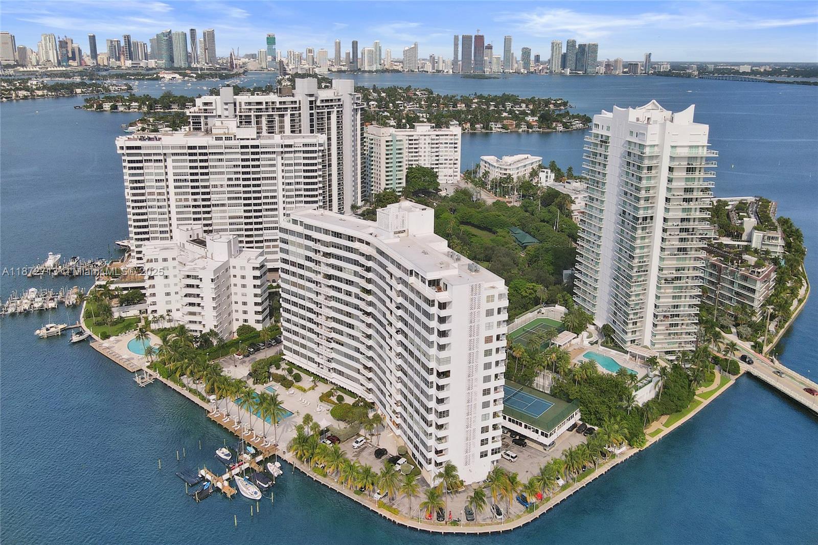 Sweet SoBe Pied-a-terre 1-bedroom, 1.5-bath updated unit with 897 sq ft and sweeping Biscayne Bay views from every room. This comfortable high-rise residence features a balcony, open kitchen, renovated bathrooms, excellent closet space, natural marble floors and new hurricane-impact windows and doors. Includes 1 assigned parking space and a full range of amenities: heated bayside pool, jacuzzi, gym, tennis court, BBQ area, bike storage, media/recreation room, 24-hour doorman, concierge, valet parking, and laundry on each floor. Located on exclusive Belle Isle, residents enjoy a vibrant Miami Beach lifestyle with beautiful beaches, cultural attractions, and convenient urban comforts just minutes away.