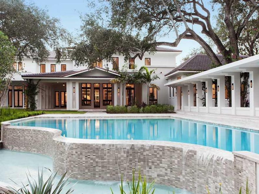 Brand-new contemporary neo-classical estate designed by renowned architect Jorge Hernandez, nestled in the lush Snapper Creek Lakes Community. A sprawling corner lot with rolling hills on Fringe Lake is the ultimate in luxury, blending indoor & outdoor li ving with sprawling terraces, patios & outdoor pavilions nestled under mature 100+ yr old oak trees & mature vegetation. Marble and limestone flooring and details throughout, extensive millwork and vaulted ceilings. An impressive retreat to be had!