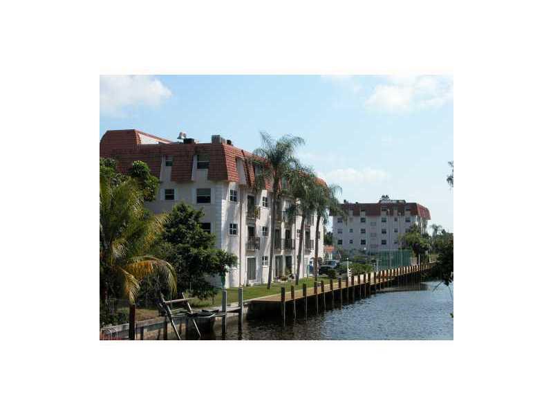 Quiet bldg. on a residential cul-de-sac in Coral Ridge Isles. Large 1 bedroom, 1 bath in pristine condition. Great 4th floor water views. Ocean /access waterfront! Dock available! Tennis courts, pool, and club house. Unit features light laminate flooring throughout, upgraded bathroom with newer vanity, and refaced kitchen cabinets with backsplash. Close to the beach, I95, and A rated schools! This is a must see!