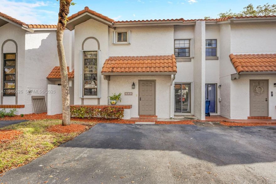 Beautiful golf course setting in the highly sought-after gated community of Villas of Briar Bay! Enjoy picturesque, tree-lined streets shaded by majestic oaks. Meticulously maintained 2-story townhouse thoughtfully updated by long-term owner. Accordion hurricane shutters,wood-like flooring throughout, and granite kitchen that opens to gated backyard w/serene golf course views. Full-size washer & dryer conveniently located in laundry closet off the kitchen. Powder room downstairs. The primary suite has a private balcony & large walk-in closet, while the second bedroom is a loft-style space with its own walk-in closet. Residents enjoy the community pool and clubhouse, all in a fantastic location just minutes from The Falls, LifeTime Fitness, Publix, top-rated schools, and major roadways.