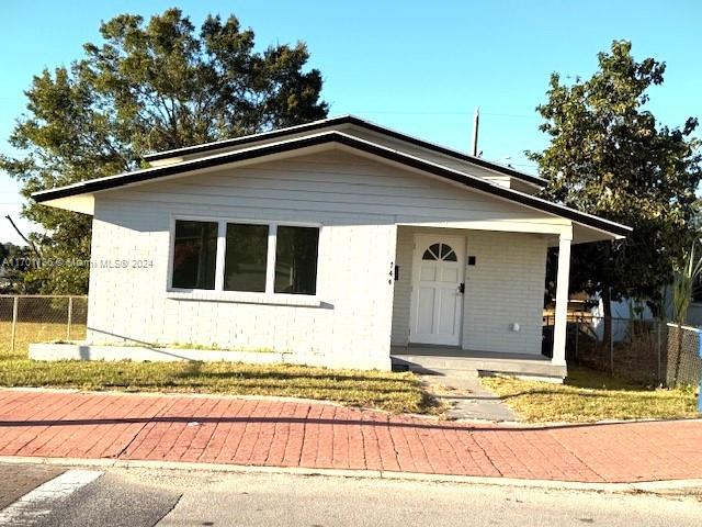 Price adjustment-motivated seller. Multi-level 3/2 single family home with plenty of room for the entire family. When you approach the home, you are welcomed by a small but inviting open porch. Upon entering the home, on the main level, you will find a very spacious living room, dining area and kitchen with new cabinets and stainless-steel appliances. From the kitchen, take a few steps down to the lower level to find a full bathroom, a large laundry room which can generously accommodate to work as laundry/pantry, or laundry/mud room since it has a backdoor leading to backyard/carport. Also, on the lower level you will find the family room with sliding glass doors that lead to the back patio and carport with terrazzo floors. Terrazzo needs TLC to bring back to its former glory.