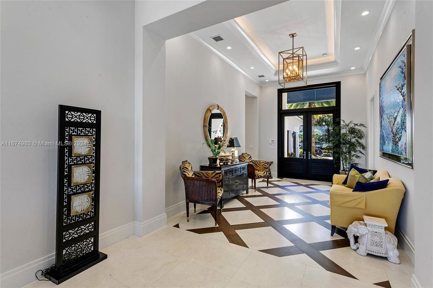 Experience luxury living at its finest in this truly breathtaking waterfront Admirals Cove home. Home boasts breathtaking panoramic navigable water views. Constructed in 2017, this masterpiece blends elegant design w/ comfort. 3 BRs, 4.1 BA & 3-car garage. Private boat dock. Open floor plan flows seamlessly, accentuated by a cozy operational fireplace, abundant natural light and stunning waterfront views. Features include a large gourmet kitchen w/ pantry and lavish primary BR suite w/ large walk-in closets. Step outside to your private oasis with an inground pool-complete w/ counter current & wave exercise feature-ideal for fitness enthusiasts or relaxing swims. Tennis Membership. Great opportunity to experience resort living in one of the country's premier club communities.