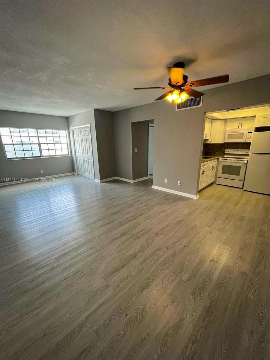 Welcome to your new home or next prime investment property right in the heart of Hollywood, FL. This beautifully maintained condo is located in a quiet neighborhood, perfect for those seeking easy access to everything. Step inside and enjoy a spacious, open layout with wood-like vinyl floors, plenty of closet space, spacious bedrooms, brand new AC, newer appliances and a functional kitchen. The unit comes with two assigned parking spaces, a rarity in the area. Just minutes from Hollywood Beach, supermarkets, shops, local dining, hospitals and a golf country club. Quick access to I-95, Aventura Mall, and Fort Lauderdale Airport. Don’t miss out on owning a slice of Hollywood just minutes from the beach. Schedule your showing today!