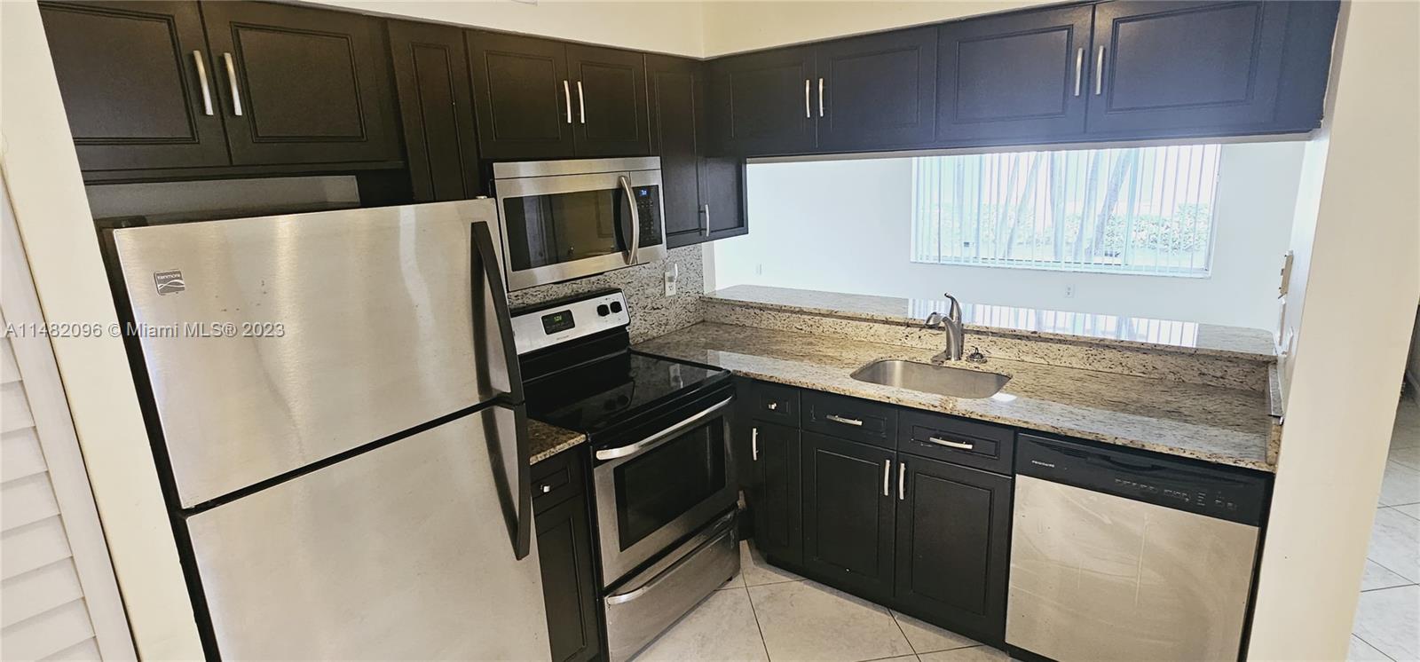 It's a spacious 2 bed, 2 bath with an open floor plan, stainless steel appliances, and European-style bathrooms. The tile floors, custom storage, and walk-in closet are great features. The gated community offers a clubhouse with a pool, hot tub, and gym, and utility/water is included. It's conveniently located near restaurants and shopping. We will completely paint, a new washer/dryer closet, redo the kitchen cabinets, re-floor both bedrooms, and make other repairs.