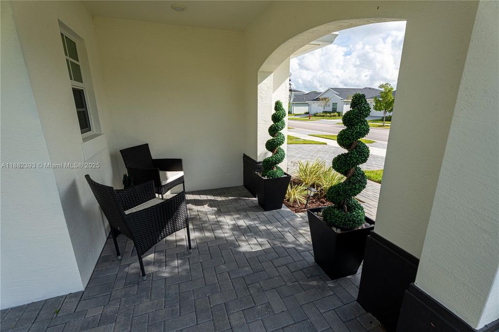 Photo of 6172 NW Sweetwood Dr, Port St Lucie, FL 34987 (MLS # A11882393)