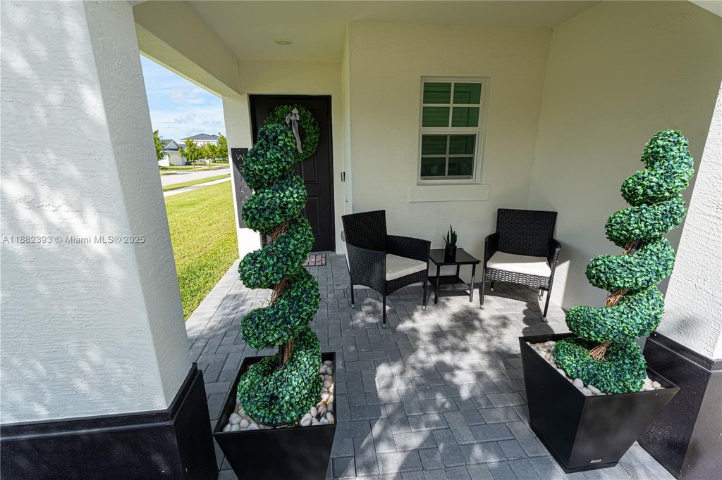 Photo of 6172 NW Sweetwood Dr, Port St Lucie, FL 34987 (MLS # A11882393)