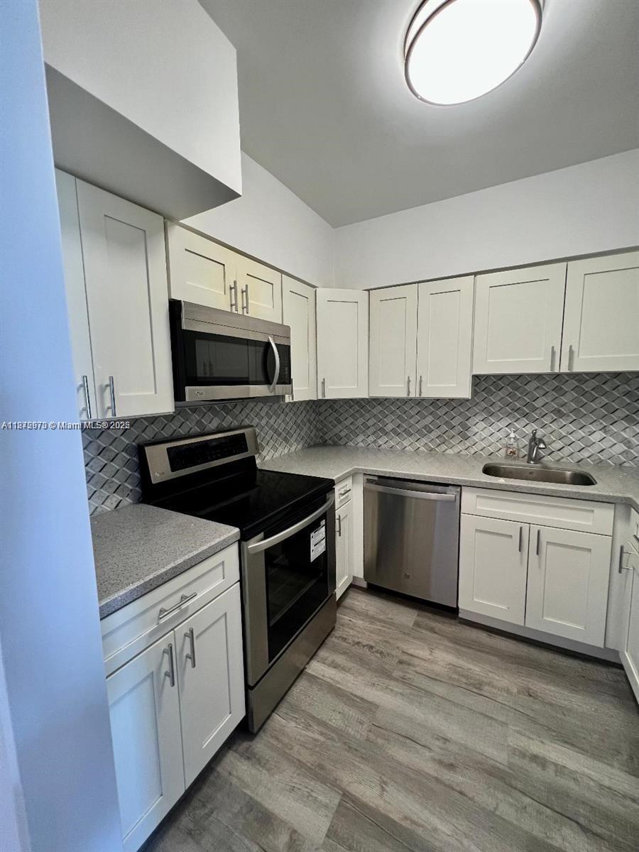 Newly renovated immaculate two bedroom/two bathroom unit with a ton of closet space and lots of natural light. One of very few units in the building with a balcony! Great city and canal views from every room. Beautiful kitchen with a new dishwasher and range. New AC with air purifier. 1 assigned parking space, second space is unassigned. One large storage space. The building has a nice big pool and a fitness center. Wayne ave is a quiet residential area, very charming and green. Walking distance to the beach. Minimum 1 year lease, renting allowed after first year. 40 year recertification done and 50 year is almost completed. No major construction in the building.