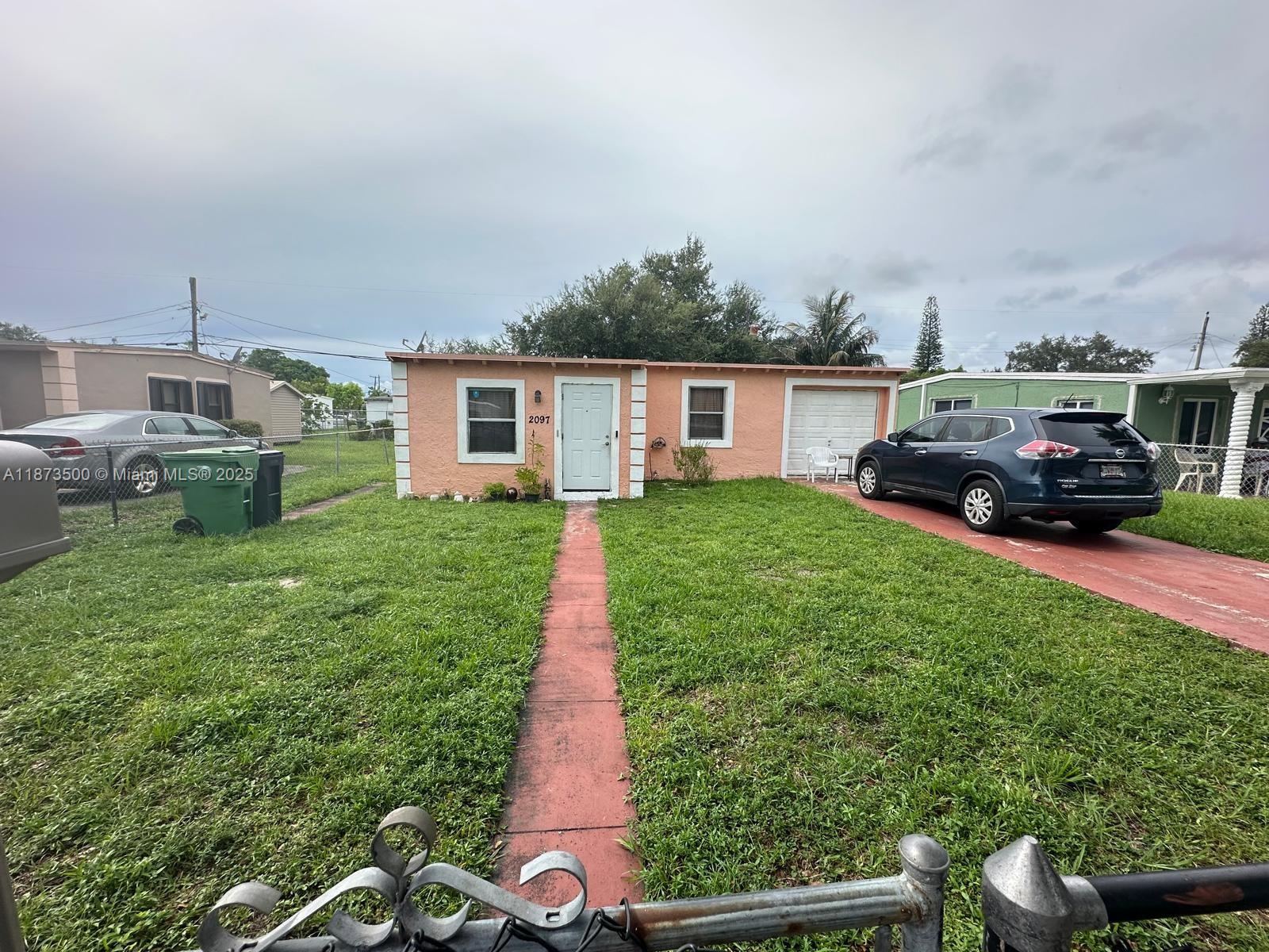 Cozy starter home in a growing neighbourhood with a lot of potential. This property is fenced and the garage can be converted into a third bedroom. Nestled in a prime location in one of the up-and-coming areas in Miami.