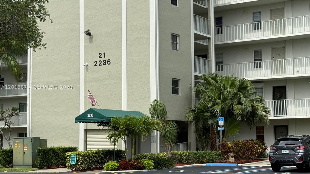 Photo of 2236 N Cypress Bend Dr #207, Pompano Beach, FL 33069 (MLS # A12015870)
