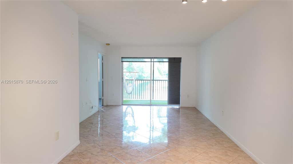 Photo of 2236 N Cypress Bend Dr #207, Pompano Beach, FL 33069 (MLS # A12015870)