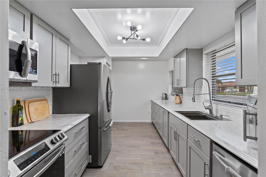 Photo of 6109 Ambertree Ln, Green Acres, FL 33463 (MLS # A11946356)