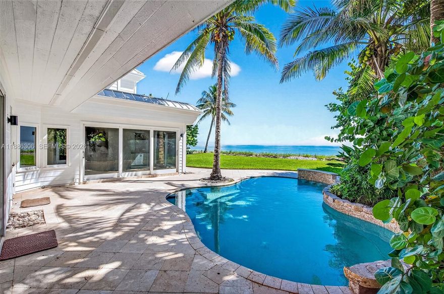 Accepting Back up Offers. Direct oceanfront estate set on over an acre in a gated cul-de-sac enclave of only 20 homes, located south of John’s Island and minutes from Vero’s seaside village, boutiques, and dining.Beautifully landscaped grounds and exceptional privacy complement the opportunity to expand or add a guest residence.This residence offers 5 bedrooms, 6 baths, an oceanfront office + flex/gym room.Interiors have been updated with travertine and oak floors, limestone baths, and a chef’s kitchen with Sub-Zero, Wolf appliances, and leather-finished dolomite counters. An oceanfront pool captures sweeping views of the Atlantic and its wide, uncrowded beach. Once owned by Broadway legend Bernadette Peters, this rare property embodies exclusivity, elegance, and timeless coastal living.Sizes approx./subj. to error