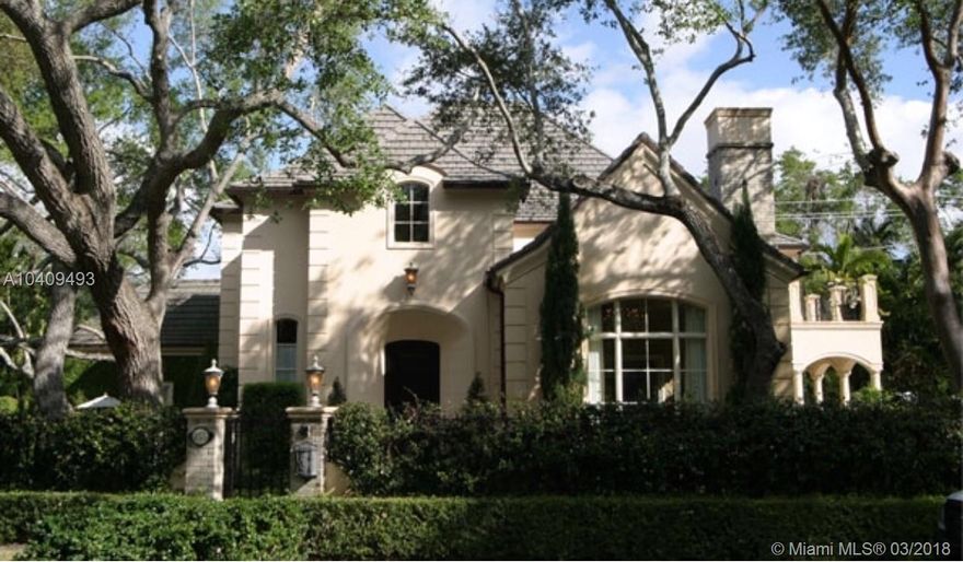 Updated and remodeled in 2016, the two-story 4 bedroom and 4.5 bath French Manor style home boasts a cherry wood paneled library, a 250 bottle wine closet, an elegant wood burning fireplace, vaulted ceilings, impact resistant wood & aluminum clad weather shield windows and doors, hardwood and limestone floors and staircase, central vacuum system, custom built-ins and light fixtures, hand crafted mosaic work, custom curtains, windows treatments and elaborate millwork. The oversized kitchen is enhanced with top of the line Wolf and Sub-zero appliances, a wine chiller, custom cabinetry with ample storage and features detailed wood cove ceilings. Outdoor resort style living space with heated pool, large terraces, lush landscaping w/custom lighting & fountains.