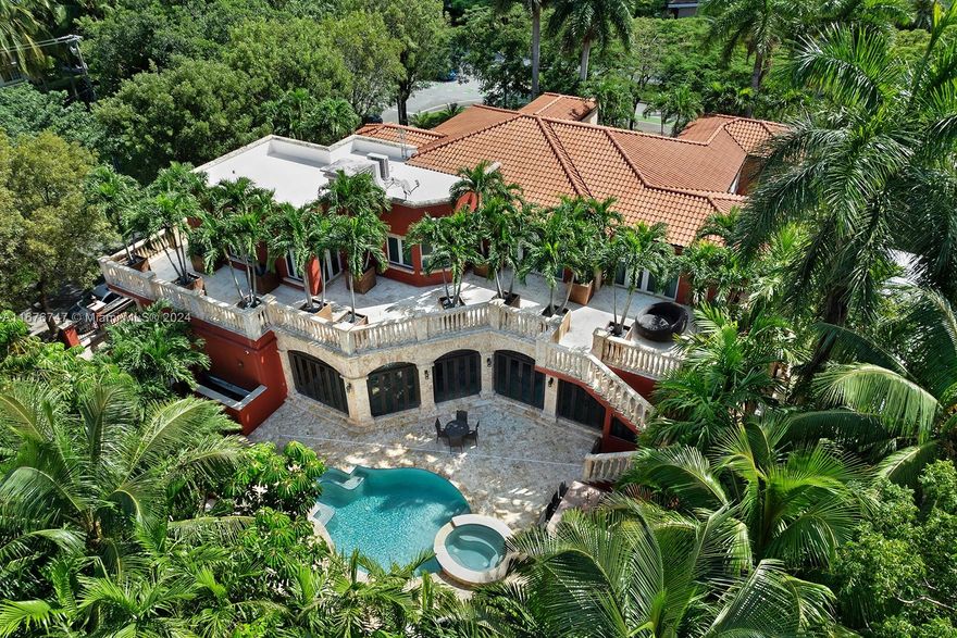 Indulge in luxury with this stunning estate home in the historic Brickell area, situated on a 13,500 sq.ft. corner lot. It features 6 bedrooms, 7.5 baths, a state-of-the-art movie theater, temperature control wine cellar, an office with a private entrance and cigar room. The gourmet kitchen boasts top-tier appliances and ample counter space. Enjoy the outdoor pool, jacuzzi, and summer kitchen within beautifully landscaped grounds. The ground level offers a spacious gym, ample storage, and a 3-car garage with a hurricane bunker. Built in 2007, this home showcases exquisite finishes, including Italian marble flooring and a generator powering a full home for 2 weeks. Walking distance from Brickell City Center, Brickle Avenue and top-rated schools, it's perfect for entertaining or family time.