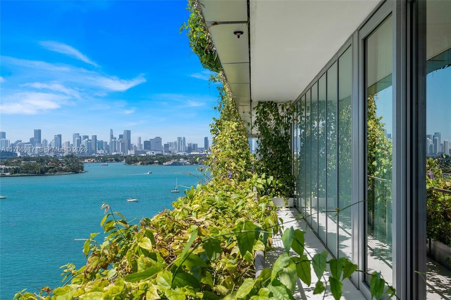 MID-CENTURY MINIMALIST INTERIORS BY AUSTIN HARRELSON WITH STUNNING SUNSET VIEWS OVER THE BAY & CITY SKYLINE FROM THIS SPRAWLING 5-BEDROOM RESIDENCE AT MONAD TERRACE BY AWARD-WINNING ARCHITECT JEAN NOUVEL! Flowthru 5 Bed + 5.5 Bath Residence in 3,936 SF wrapped in 1,474 SF Terraces. Private Foyer greets you to Oversized Great Room. Custom Wall-to-Wall Bookcases + 10 FT Ceilings in Elegant Venetian Plaster. Poliform Kitchen in White Calacatta Gold Marble w/Sculptural Cantilevered Marble Island & Wine Rack + Gaggenau Appliances. Custom Oak Breakfast Banquet. Primary Suite w/Bathroom in Calacatta Gold Marble & Floating Wood Vanity + Steam Shower & Ago Soaking Tub by Antonio Lupi. Laundry Room Doubles as Service Quarters. Diagonal Teakwood floors. Private Elevator with Direct Access to Garage.