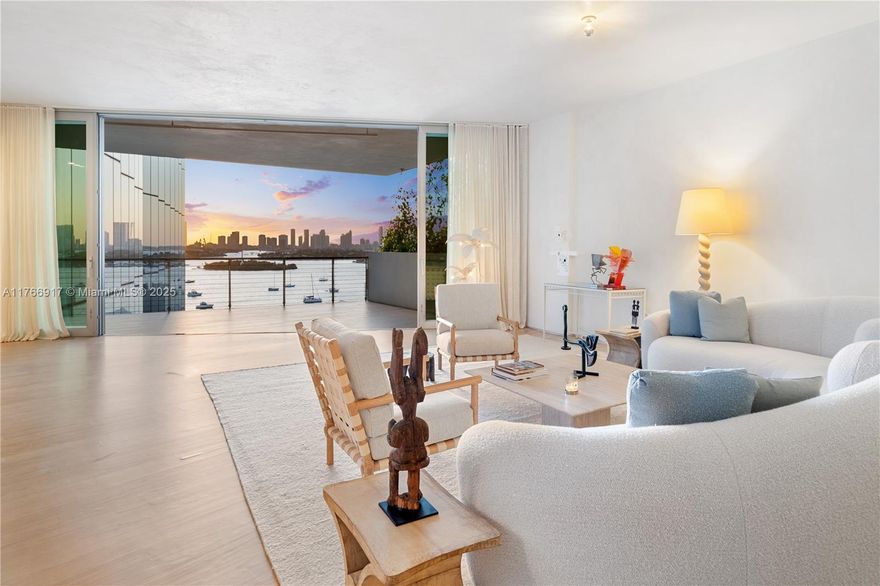 MID-CENTURY MINIMALIST INTERIORS BY AUSTIN HARRELSON WITH STUNNING SUNSET VIEWS OVER THE BAY & CITY SKYLINE FROM THIS SPRAWLING 5-BEDROOM RESIDENCE AT MONAD TERRACE BY AWARD-WINNING ARCHITECT JEAN NOUVEL! Flowthru 5 Bed + 5.5 Bath Residence in 3,936 SF wrapped in 1,474 SF Terraces. Private Foyer greets you to Oversized Great Room. Custom Wall-to-Wall Bookcases + 10 FT Ceilings in Elegant Venetian Plaster. Poliform Kitchen in White Calacatta Gold Marble w/Sculptural Cantilevered Marble Island & Wine Rack + Gaggenau Appliances. Custom Oak Breakfast Banquet. Primary Suite w/Bathroom in Calacatta Gold Marble & Floating Wood Vanity + Steam Shower & Ago Soaking Tub by Antonio Lupi. Laundry Room Doubles as Service Quarters. Bleached Teakwood floors. Private Elevator with Direct Access to Garage.