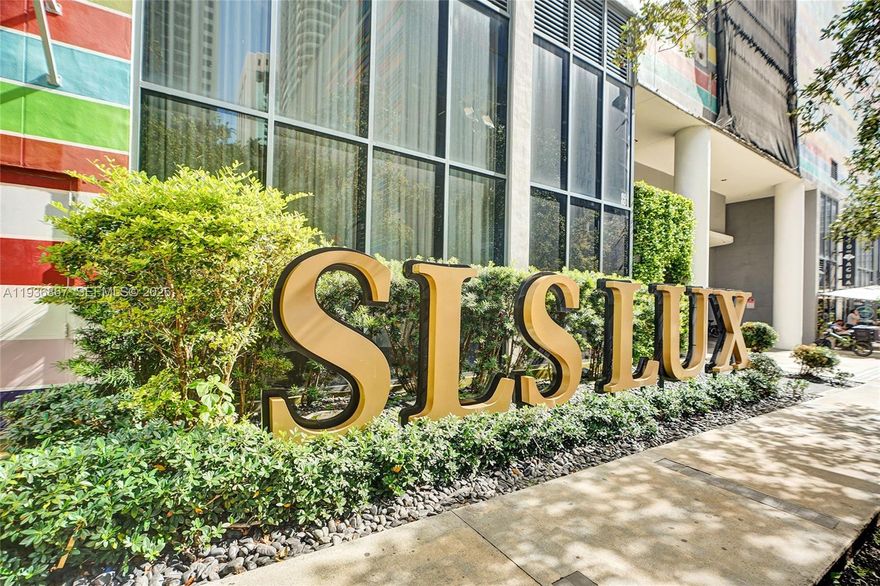 Experience elevated urban living in this stylish 24th-floor corner residence at SLS LUX, located in the heart of Brickell. This well-designed two-bedroom, two-bath home offers bright east and north exposures, a spacious wraparound balcony, and expansive skyline views showcasing Miami’s dynamic cityscape. Floor-to-ceiling impact windows flood the interior with natural light, creating an open and airy atmosphere ideal for both everyday living and working from home.
The functional layout provides excellent flow and privacy, making the residence suitable as a primary home, second residence, or investment property. Ownership includes access to luxury, resort-style amenities such as private elevator entry, 24-hour concierge and valet, multiple swimming pools, a state-of-the-art fitness center, full-service spa, tennis court, resident lounges, and impeccably designed common areas.
Ideally situated just steps from Brickell City Centre, fine dining, cafés, shopping, wellness studios, and nightlife, this residence delivers unmatched walkability and convenience. A rare opportunity to own in one of Brickell’s most desirable luxury condominium buildings, offering a refined blend of location, lifestyle, and long-term value.